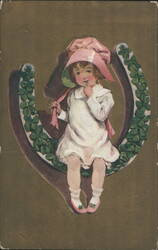 Girl in Pink Bonnet Sitting on Lucky Clover Horseshoe Postcard