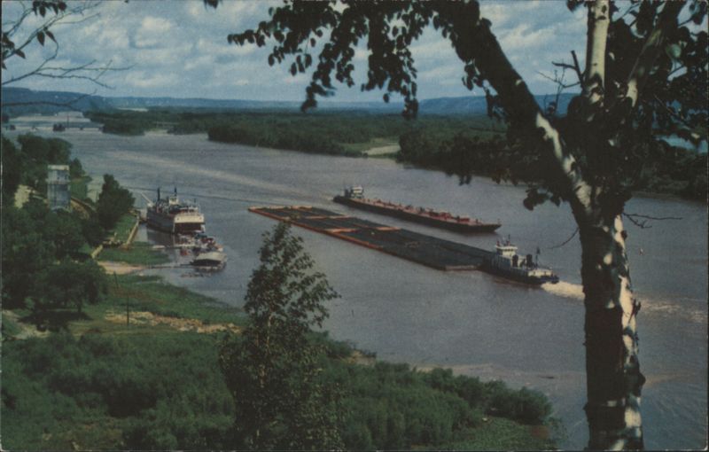 The Mighty Mississippi River with Barges and Riverboat