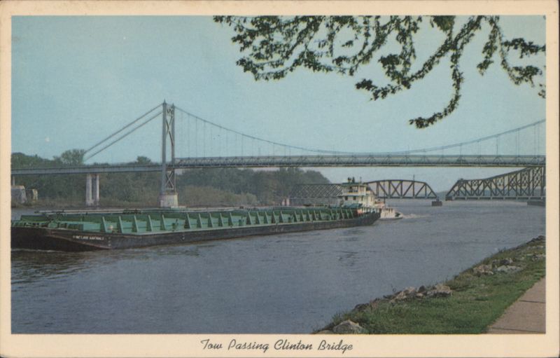 Tow Passing Clinton Bridge on Mississippi River Iowa