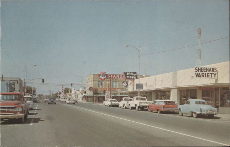 Main Street Scene with Sheehans Variety and Willcox Cafe Arizona