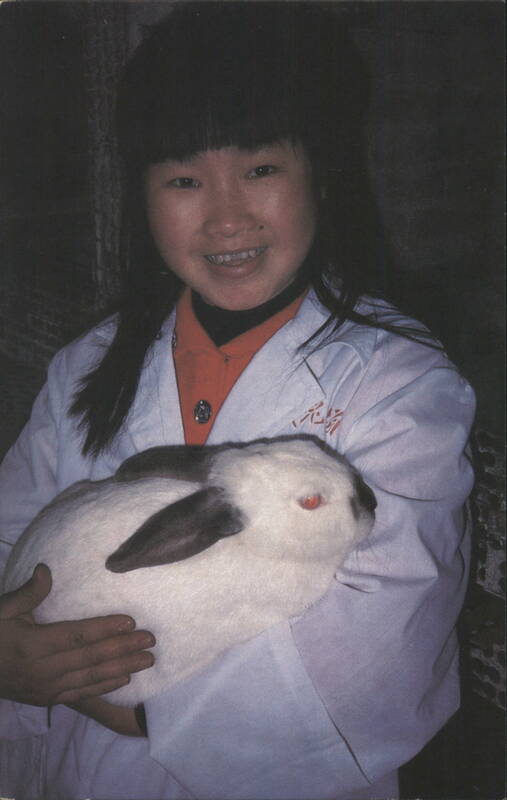 Woman Holding Rabbit, Heifer Project International China