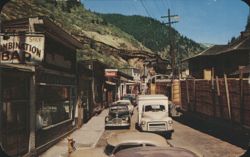 Main Street with Train and Combination Bar Postcard