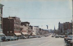 Main Street Scene with Vintage Cars and Storefronts Postcard
