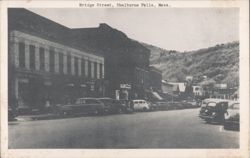 Bridge Street with Parked Cars and Storefronts Postcard