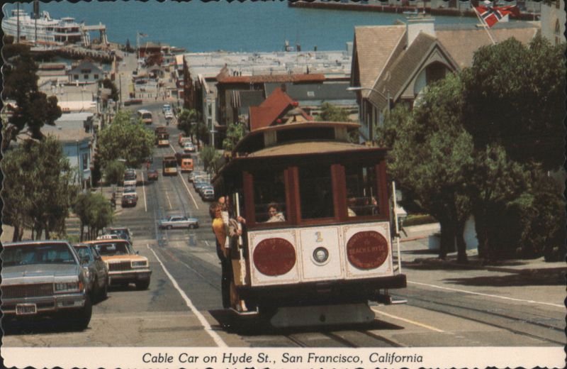 Cable Car Climbing Hyde Street Hill with Bay View San Francisco California