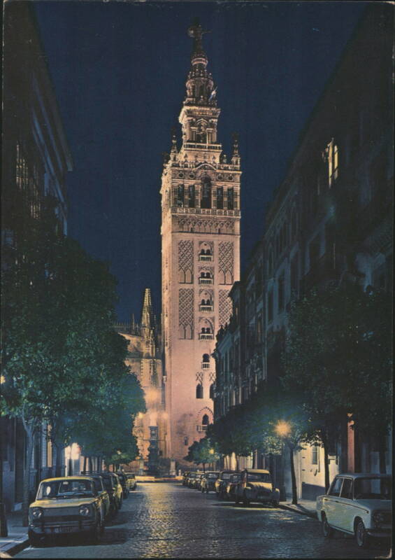 Illuminated La Giralda Tower and Street Scene at Night Sevilla Spain
