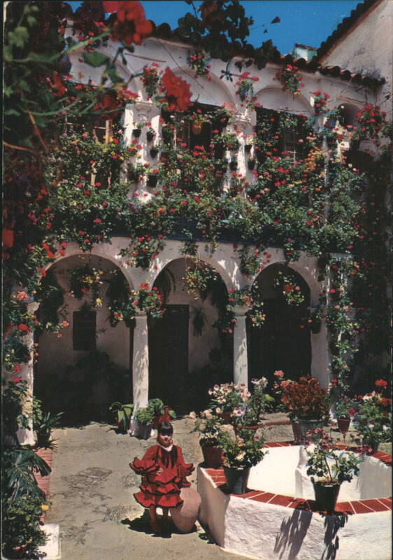 Typical Andalusian Court with Child in Flamenco Dress Spain