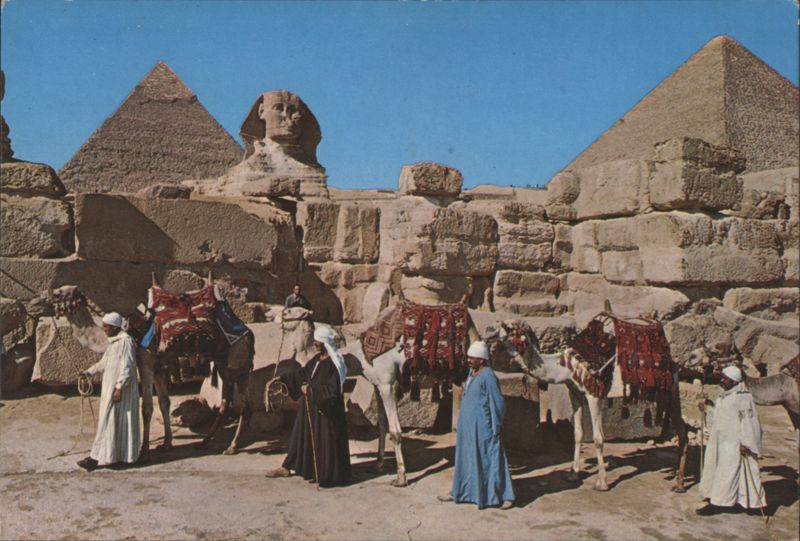 Great Sphinx and Keops Pyramid with Camels Giza Egypt