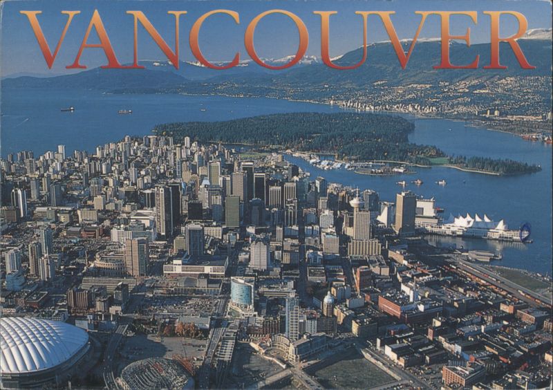 Aerial View of Skyline, Stanley Park & North Shore Mountains Vancouver BC Canada