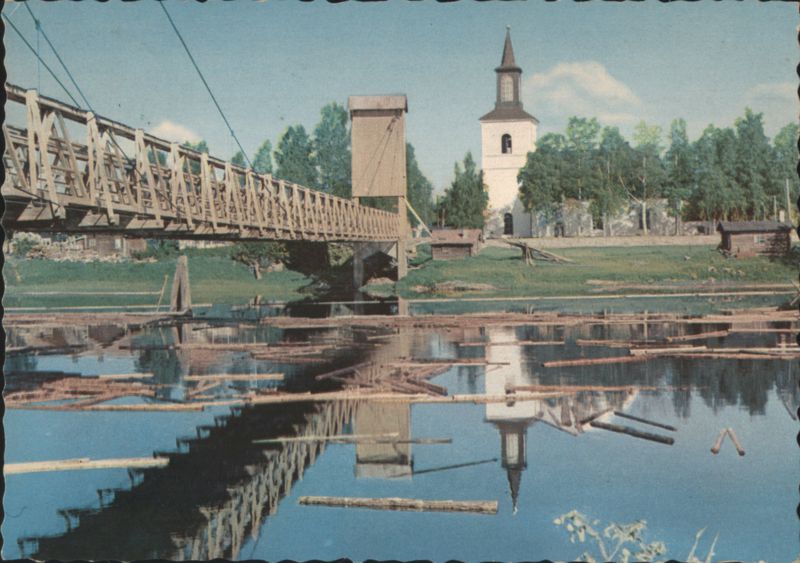 Floda Church and Wooden Bridge with Floating Logs Sweden
