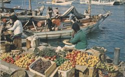 Waterfront Market with Fresh Produce and Traditional Boats Postcard