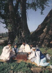 Young Scholars Playing Baduk (Go) Game under Ancient Tree Postcard