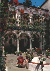 Typical Andalusian Court with Child in Flamenco Dress Postcard