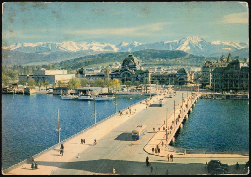 Lake Bridge, Railway Station, and Alps in Lucerne Switzerland