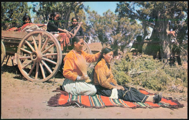 Navajo Indian Life: Woman Brushing Young Girl's Hair