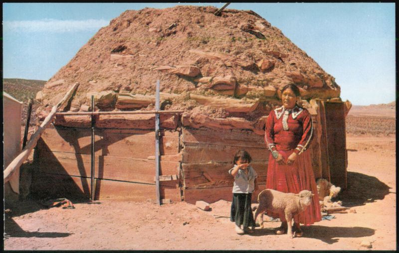 Navajo Woman and Child with Hogans on Reservation Bob Van Luchene