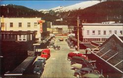 Ingersoll Hotel and Street Scene with Mountains Postcard