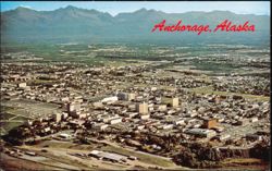 Aerial View of City with Chugach Mountains Background Postcard