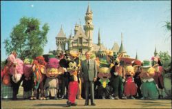 Walt Disney with Characters in Front of Sleeping Beauty Castle Postcard