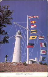 Gibbs Hill Lighthouse with Flags and Hilltop View Postcard