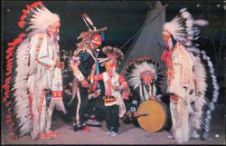 Indian War Dancers Bedecked in Full Tribal Regalia Postcard