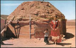 Navajo Woman and Child with Hogans on Reservation Postcard