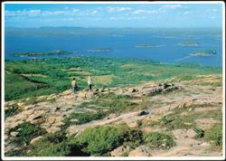 Hikers on Cadillac Mountain overlooking ocean panorama Postcard
