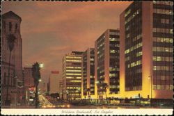 Wilshire Boulevard at Night with New Tishman Buildings Postcard