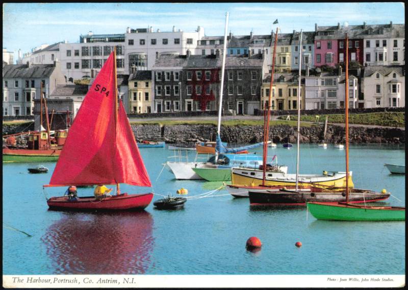 Red Sailboat and Dinghies in The Harbour Portrush United Kingdom