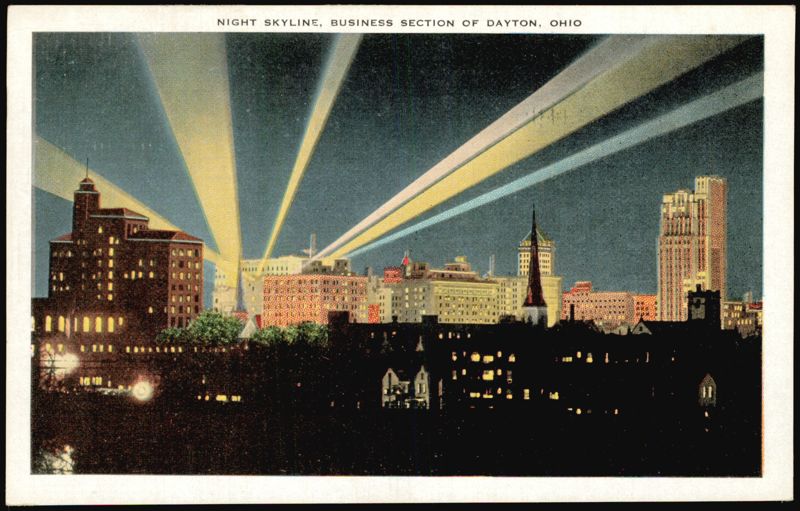 Night Skyline Business Section with Searchlights