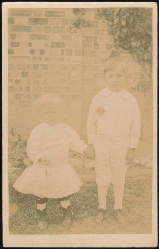 Children Holding Hands, Brick Wall Background