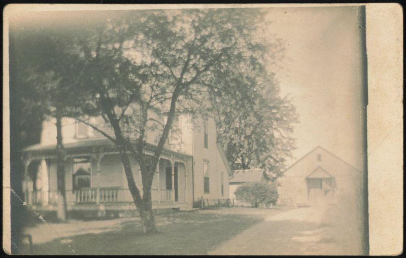 Two-Story House with Wrap-Around Porch and Barn Farming