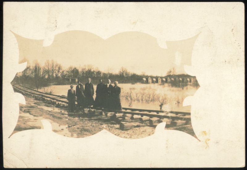 Women by Railroad Tracks, Flooded Land, March 31