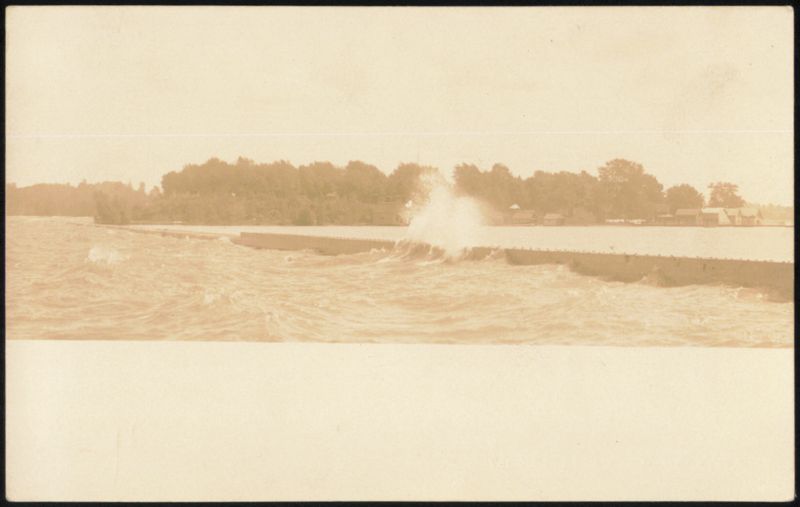 Waves Crashing Over a Breakwater Landscapes