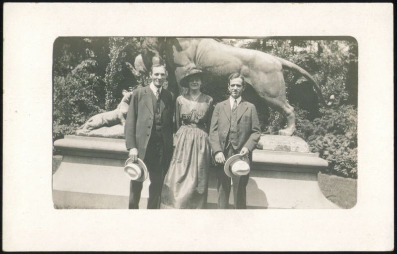 Three People with Lion and Horse Statue Unidentified People