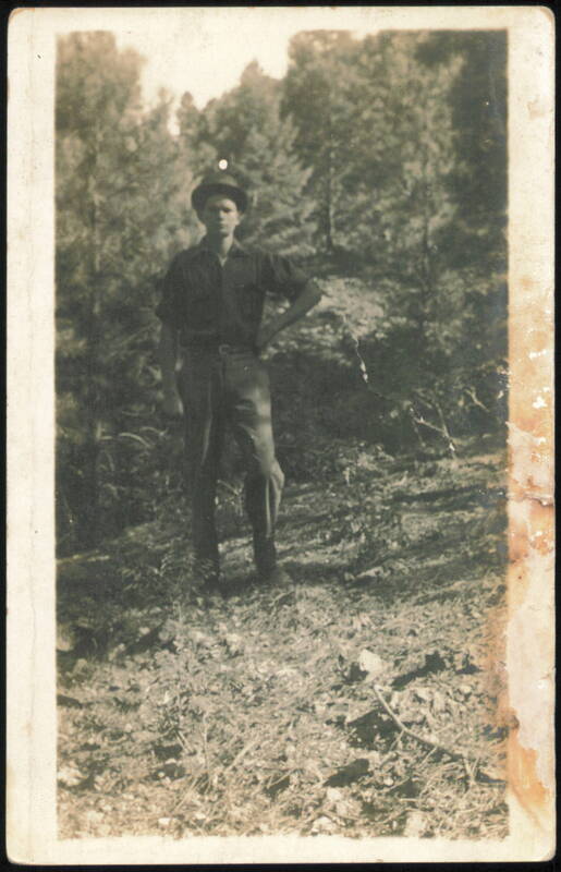 Man in Hat, Hand on Hip, Wooded Landscape Men