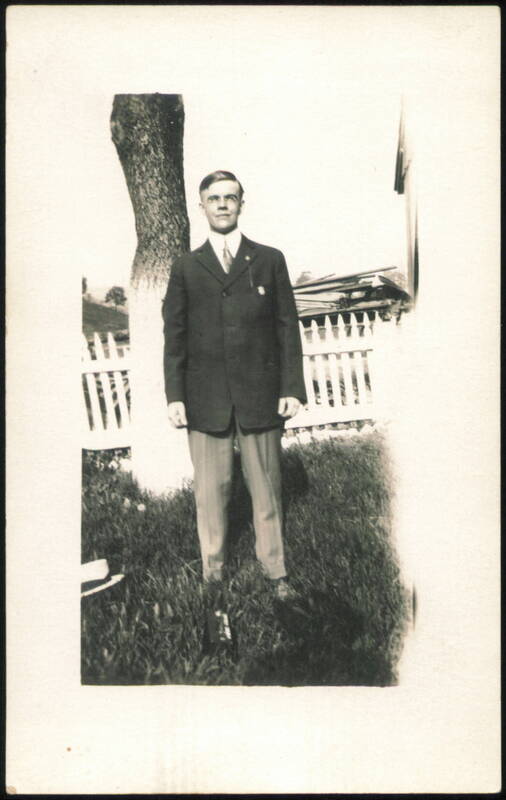 Young Man in Suit with Lapel Pin Outdoors Men