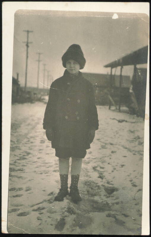 Child in Winter Coat & Hat on Snowy Street Children