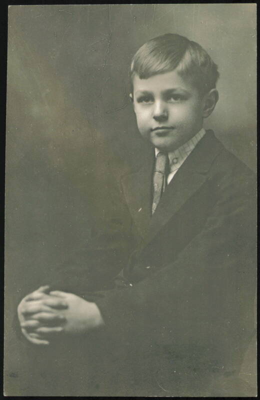 Young Boy in Suit and Tie, Hands Clasped Children