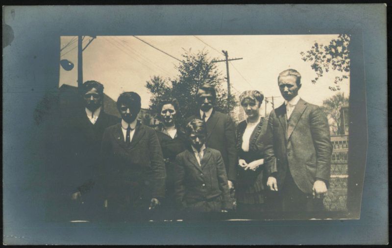 Group of Eight People Posing Outdoors Family Portaits