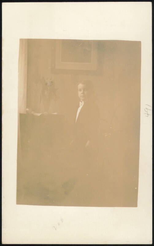 Young Boy in Suit with Bow Tie Indoor Portrait Children