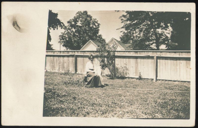 Woman & Child Sitting in Backyard Family Portaits