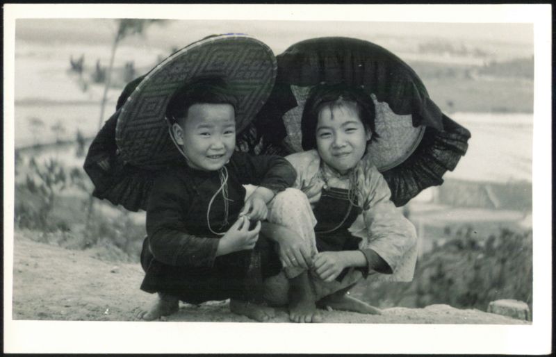 Smiling Asian Children in Large Hats