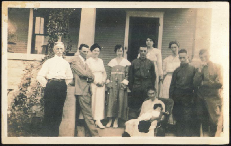 Group of 11 People in Front of House Family Portaits