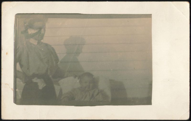 Woman in Hat with Child and Shadow Women
