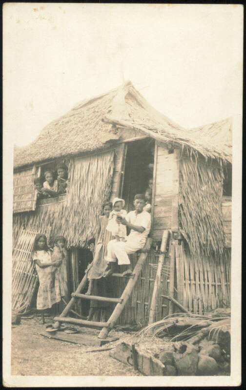 Family by Thatched Stilt House