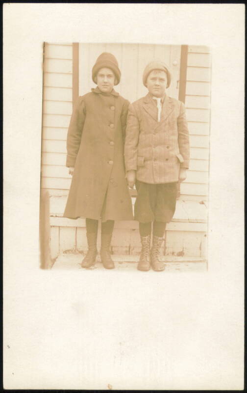 Two Children in Winter Coats & Hats