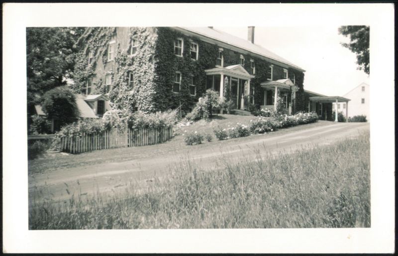 Ivy-Covered House with White Picket Fence Hotels