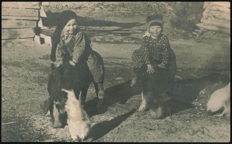 Ora and Irene Riding Dogs with Chicken Children