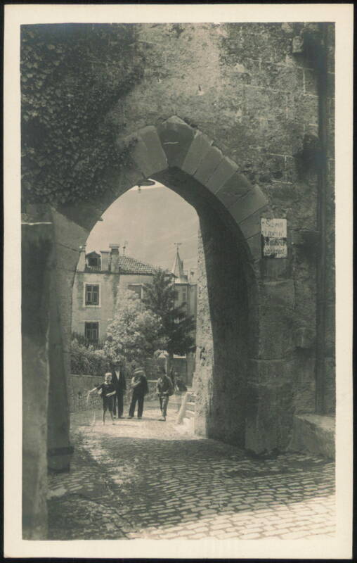 Arched Gateway with People Merano Italy